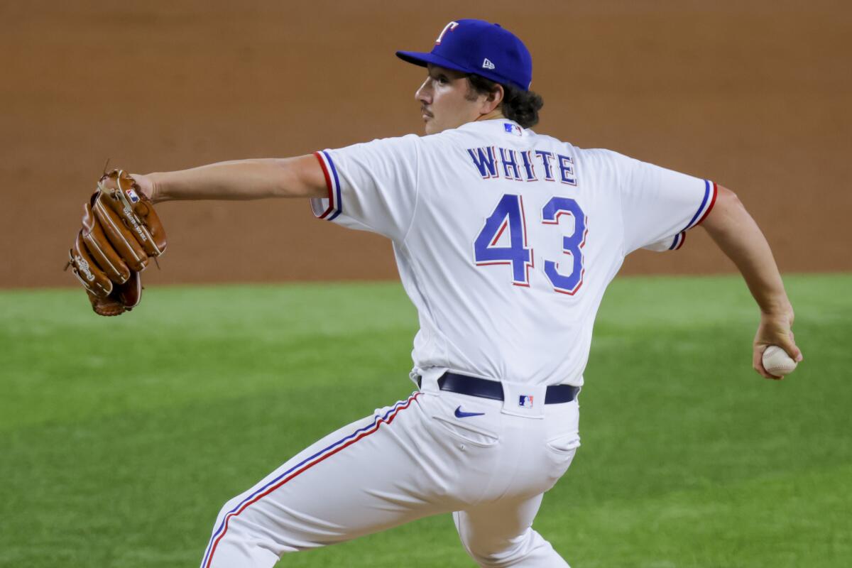 Rangers reliever Owen White pitches against the Angels on June 13 in Arlington, Texas.