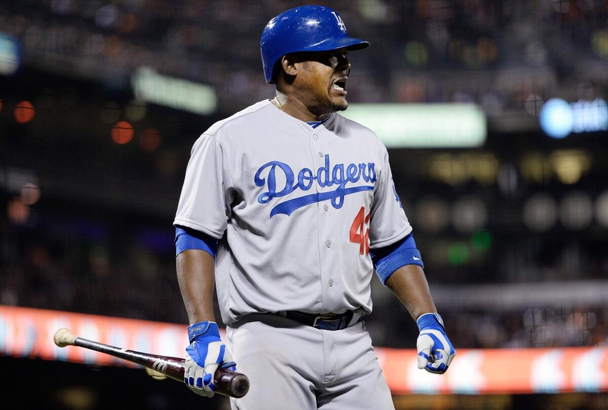 Juan Uribe reacts after striking out with the bases loaded against the San Francisco Giants on Tuesday.