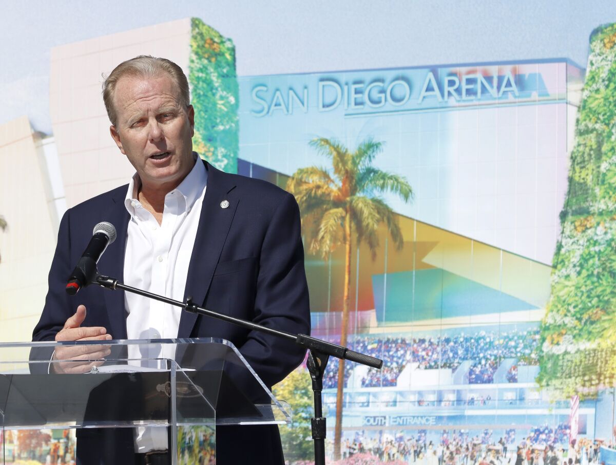 Mayor Kevin Faulconer in front of an artist's rendering of what a completely rebuilt sports arena could look like