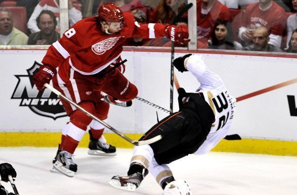 Red Wings left wing Justin Abdelkader drops Ducks defenseman Toni Lydman with an illegal hit in the second period of Game 3 on Friday night.