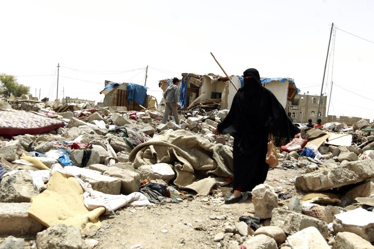 Yemenis walk amid the rubble of houses on May 18 after the structures were destroyed last month by an airstrike on a residential area in Sana. Warplanes resumed strikes on the capital the following day.