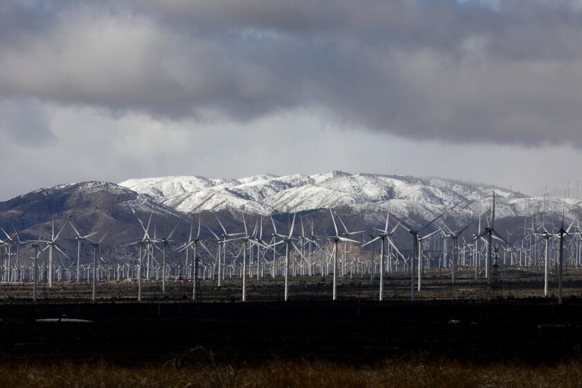 MOJAVE, CA - MARCH 23: A wind turbine farm turns wind energy into electricity off of California State Route 14 on Thursday, March 23, 2023 in Mojave, CA. Flash flooding along the eastern Sierra Nevada a week ago caused an unprecedented breach in the City of Los Angeles Department of Water and Power Los Angeles Aqueduct, as well as other damage. (Gary Coronado / Los Angeles Times)