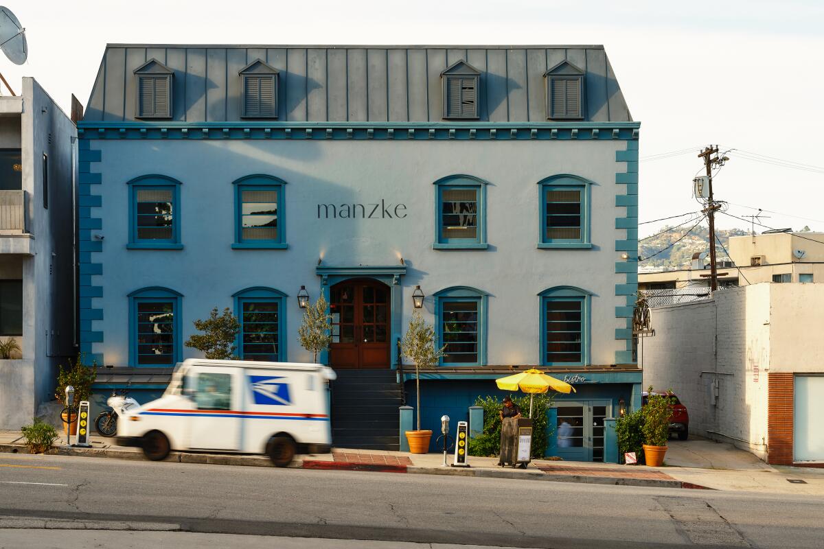 Exterior of blue Manzke and Bicyclette building on Pico Boulevard.