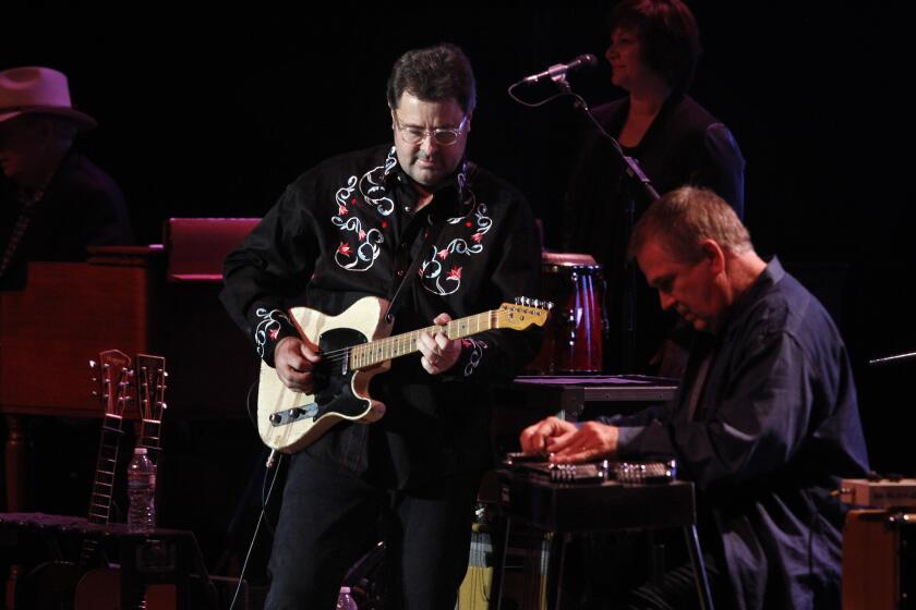 Country singer-guitarist Vince Gill, left and his collaborator, Paul Franklin, play music from their "Bakersfield" tribute album at the Rabobank Theater in Bakersfield.