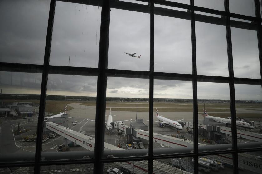 FILE - British Airways planes sit parked at Heathrow Airport in London, on Sept. 9, 2019. A Virgin Atlantic jet collided with another plane while it was being towed at Heathrow Airport on Saturday April 6, 2024, aviation authorities said. There were no reports of injuries. (AP Photo/Matt Dunham, File)