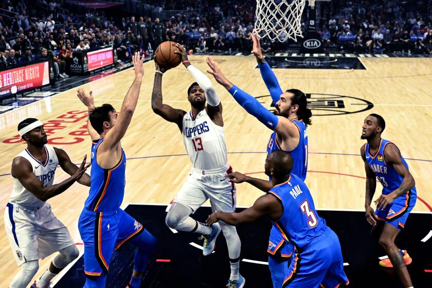 Los Angeles Clippers' Paul George (13) shoots against the Oklahoma City Thunder during the first half of an NBA basketball game, Monday, Nov. 18, 2019, in Los Angeles. (AP Photo/Ringo H.W. Chiu)