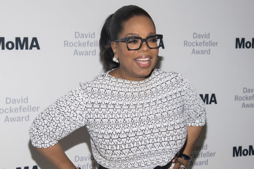 FILE - In this March 6, 2018 file photo, Oprah Winfrey attends The Museum of Modern Art's David Rockefeller Award Luncheon honoring Oprah Winfrey at the Ziegfeld Ballroom in New York. Winfrey stands to see the value of her investment in Weight Watchers shrink after the company said it hasn't signed up as many subscribers as it hoped this winter and expects its profits to suffer. Weight Watchers International's stock tumbled more than 30 percent in after-hours trading Tuesday, Feb. 26, 2019. (Photo by Charles Sykes/Invision/AP, File)