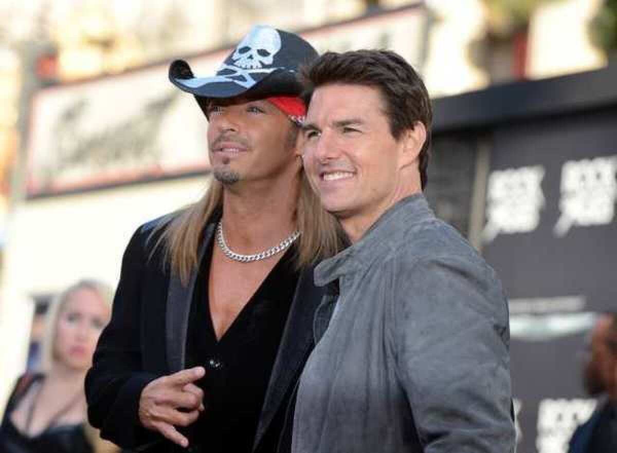 Bret Michaels and Tom Cruise pose on the red carpet at "Rock of Ages."