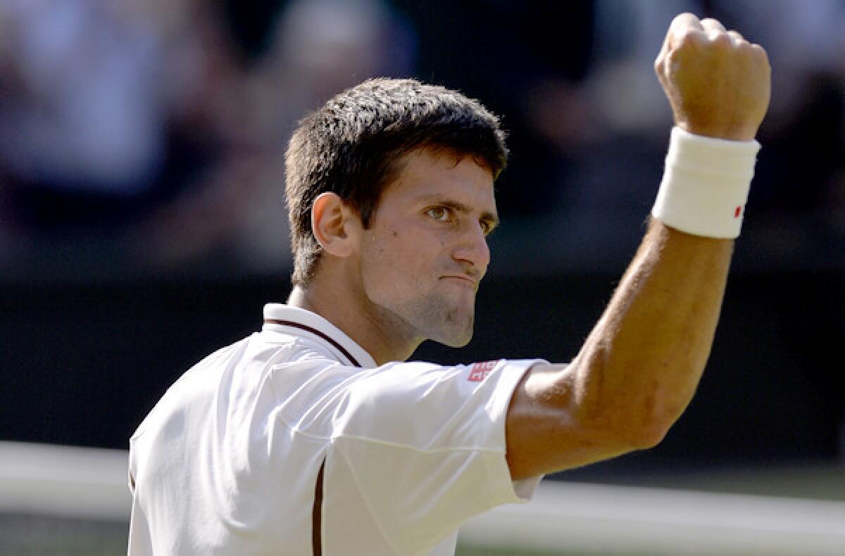 Novak Djokovic of Serbia looks toward his supporters as he celebrates a five-set victory over Juan Martin del Potro of Argentina in the men's semifinals at Wimbledon on Friday.
