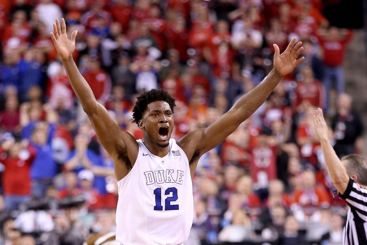 Duke freshman Justise Winslow celebrates after the Blue Devils' 68-63 victory in the national championship game over the Wisconsin Badgers.