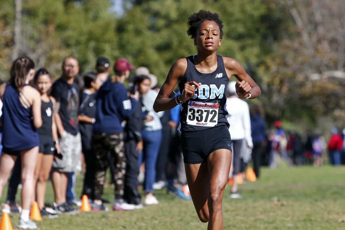 Corona del Mar's Melisse Djomby-Enyawe approaches the finish line in the Sunset Conference cross-country finals.