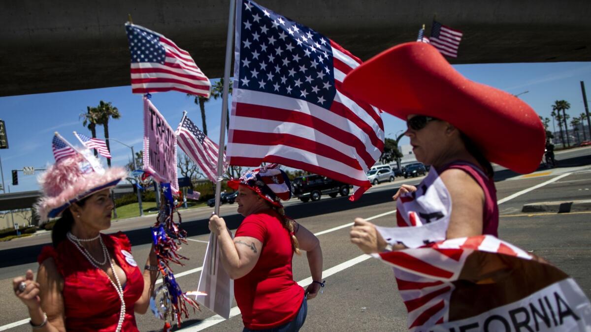 Supporters of Travis Allen, an assemblyman who is running for governor, rally Saturday outside the state Republican convention in San Diego.