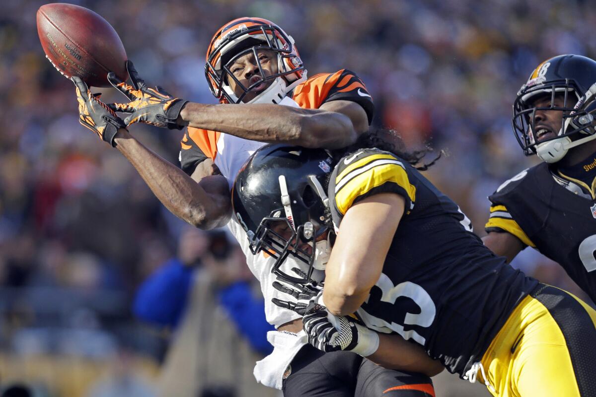 Steelers safety Troy Polamalu breaks up a pass intended for Bengals receiver A.J. Green during a game on Dec. 23, 2012.