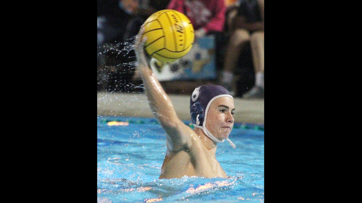 Crescenta Valley High's Reagan Hesse shoots and scores against Santa Monica in a CIF Southern Section Division IV boys' water polo match at Adolfo Camarillo High School on Wednesday, Nov. 18, 2015.
