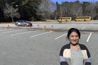 Nancy Gobran, instructor and owner of Safety Driving School, poses in an empty parking lot where she holds her driving lessons on Feb. 6, 2024 in Stone Mountain, Georgia. (AP Photo/Sharon Johnson)