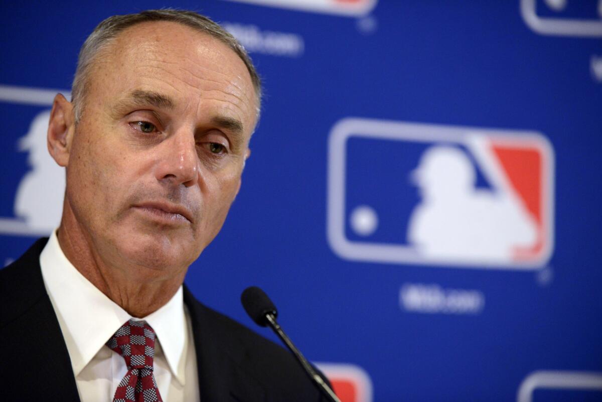 Major League Baseball Commissioner Rob Manfred speaks to the media Aug. 13 in Chicago.