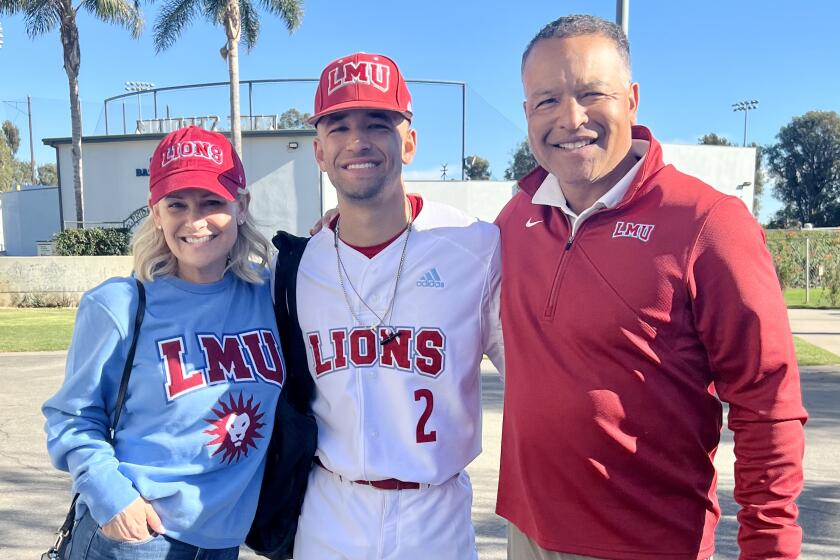 Dodgers manager Dave Roberts with his son Cole and wife Tricia.