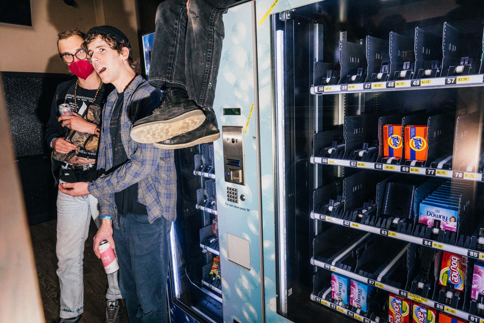 Audience members at Laundry Wand gather wherever there's space, even around laundry detergent vending machines.