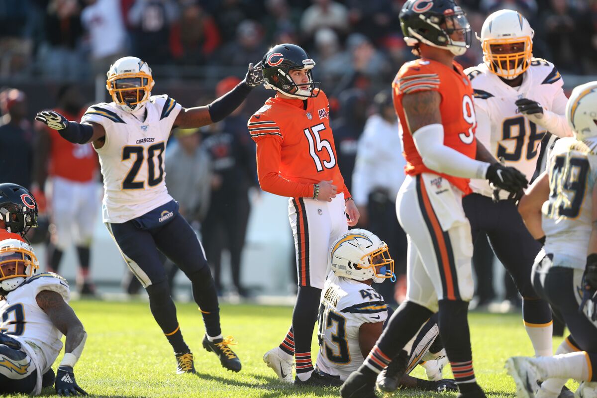 Defensive back Desmond King, left, celebrates after Bears kicker Eddy Pineiro misses a field-goal attempt as time expires in the Chargers' 17-16 victory Sunday.