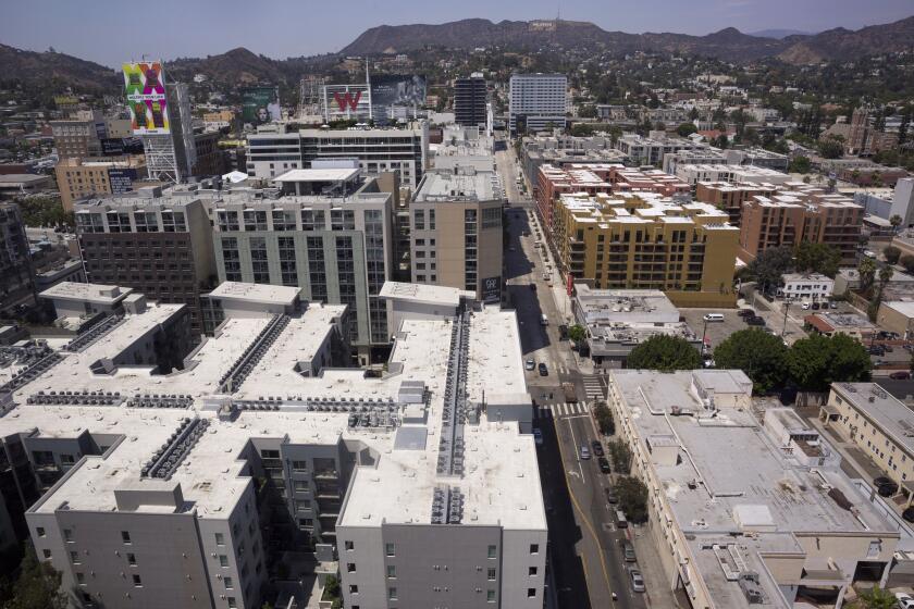 In this Monday, July 30, 2018, photo, several apartments line the streets as seen from the offices of the AIDS Healthcare Foundation in Los Angeles. The AIDS Healthcare Foundation and Alliance of Californians for Community Empowerment Action are sponsoring a measure known as Proposition 10. The measure would let cities and counties regulate rental fees in buildings current state law shields from such control. (AP Photo/Damian Dovarganes)