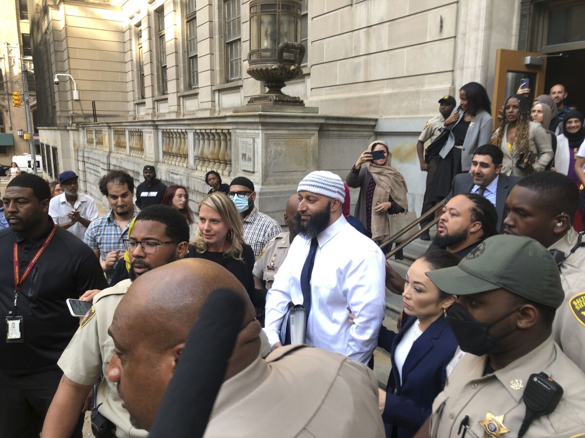 Adnan Syed leaves a courthouse.