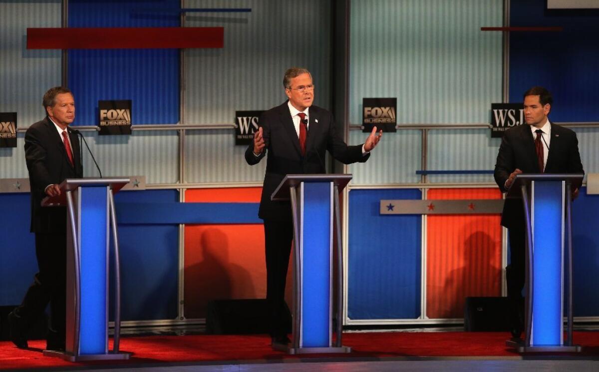 Many watched Tuesday night's debate to see whether Jeb Bush, center, would make a showing, while others watched to see how Fox Business, which moderated the debate, would react.
