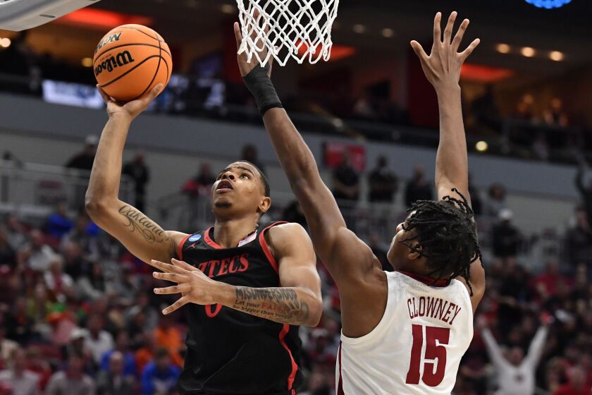 San Diego State forward Keshad Johnson (0) shoots against Alabama forward Noah Clowney (15) in the first half of a Sweet 16 round college basketball game in the South Regional of the NCAA Tournament, Friday, March 24, 2023, in Louisville, Ky. (AP Photo/Timothy D. Easley)