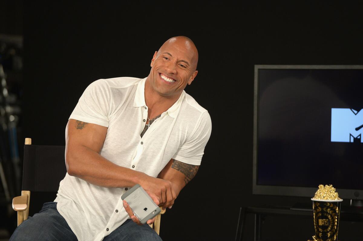 Dwayne Johnson posts sweet images and messages with kids during hospital visits while shooting "Baywatch."