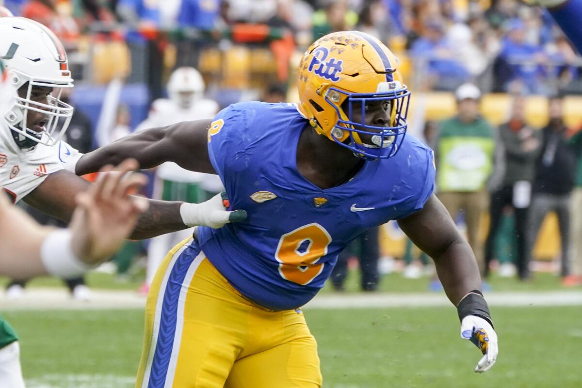 Pittsburgh defensive lineman Calijah Kancey tries to break through the Miami offensive line during a game in October 2021.