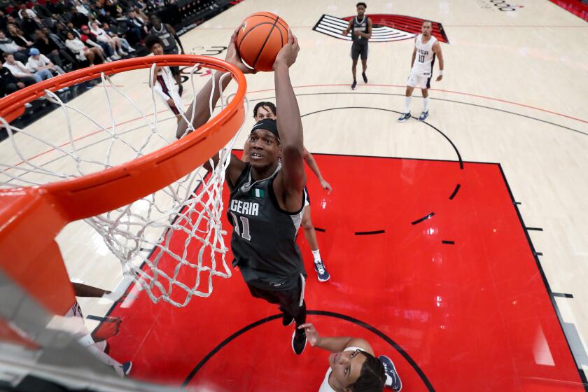 PORTLAND, OREGON - APRIL 08: Vincent Iwuchukwu #11 of World Team dunks in the first half against USA Team during the Nike Hoop Summit at Moda Center on April 08, 2022 in Portland, Oregon. (Photo by Steph Chambers/Getty Images)