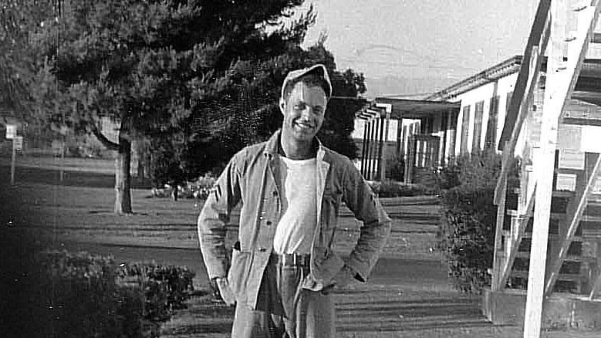 Ray Alkofer poses outside his barracks at the El Toro Marine Base in 1952.
