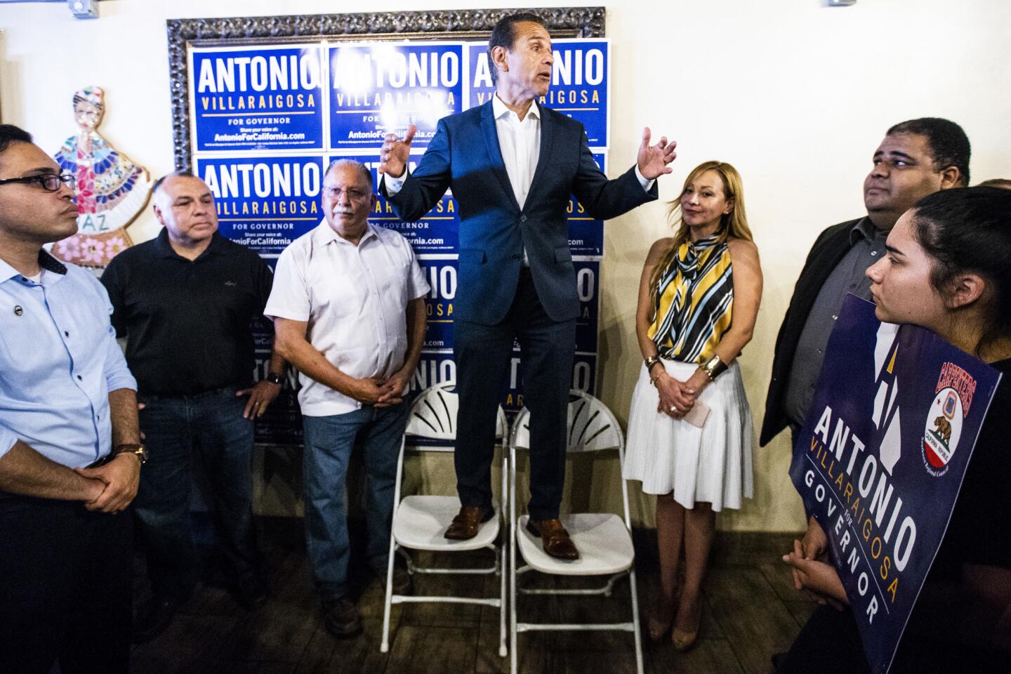 Gubernatorial candidate Antonio Villaraigosa, center, speaks at a campaign event with a carpenters union at a Riverside restaurant on Sunday.