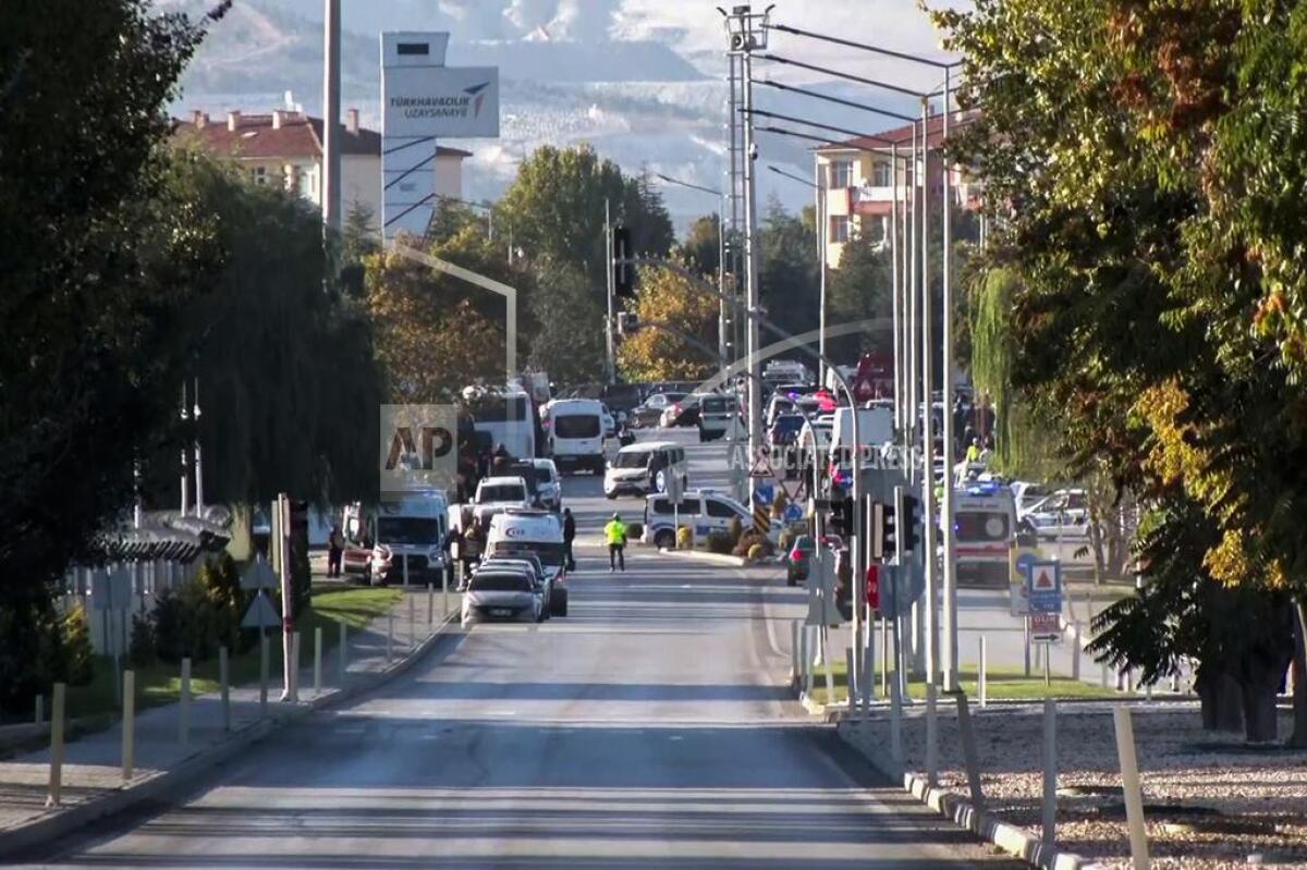 Emergency rescue teams and police officers work outside of Turkish Aerospace Industries Inc. on the outskirts of Ankara.
