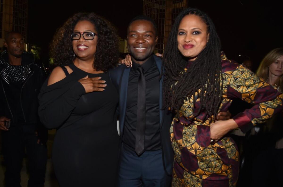 Producer Oprah Winfrey, star David Oyelowo and director Ava DuVernay celebrate their film, "Selma," at the AFI Fest in Hollywood on Nov. 11.