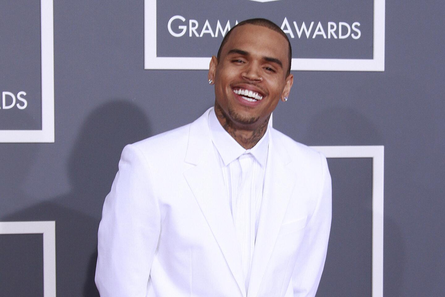 Chris Brown's name evokes controversy these days, so it's easy to forget that he once had a role model image. From high school crooner to R&B star both idolized and vilified, here's a brief look at Chris Brown's life and career. Pictured: Chris Brown at the Grammy Awards in 2013.