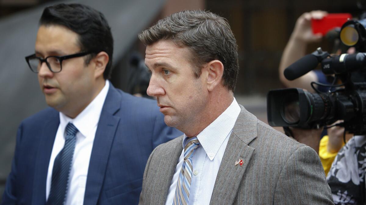 Duncan Hunter leaves San Diego federal court in September 2018, where he and his wife, Margaret Hunter, appeared for a status hearing.