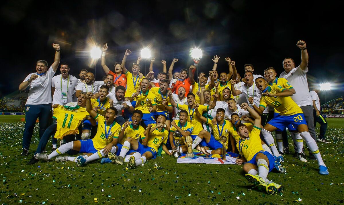 TOPSHOT - Brazils players celebrate with their medals after winning the FIFA U-17 Men's World Cup Brazil 2019 final football match against Mexico at the Bezerrao Stadium in gama, Brasilia, Brazil, on November 17, 2019. (Photo by Miguel SCHINCARIOL / AFP) (Photo by MIGUEL SCHINCARIOL/AFP via Getty Images) ** OUTS - ELSENT, FPG, CM - OUTS * NM, PH, VA if sourced by CT, LA or MoD **
