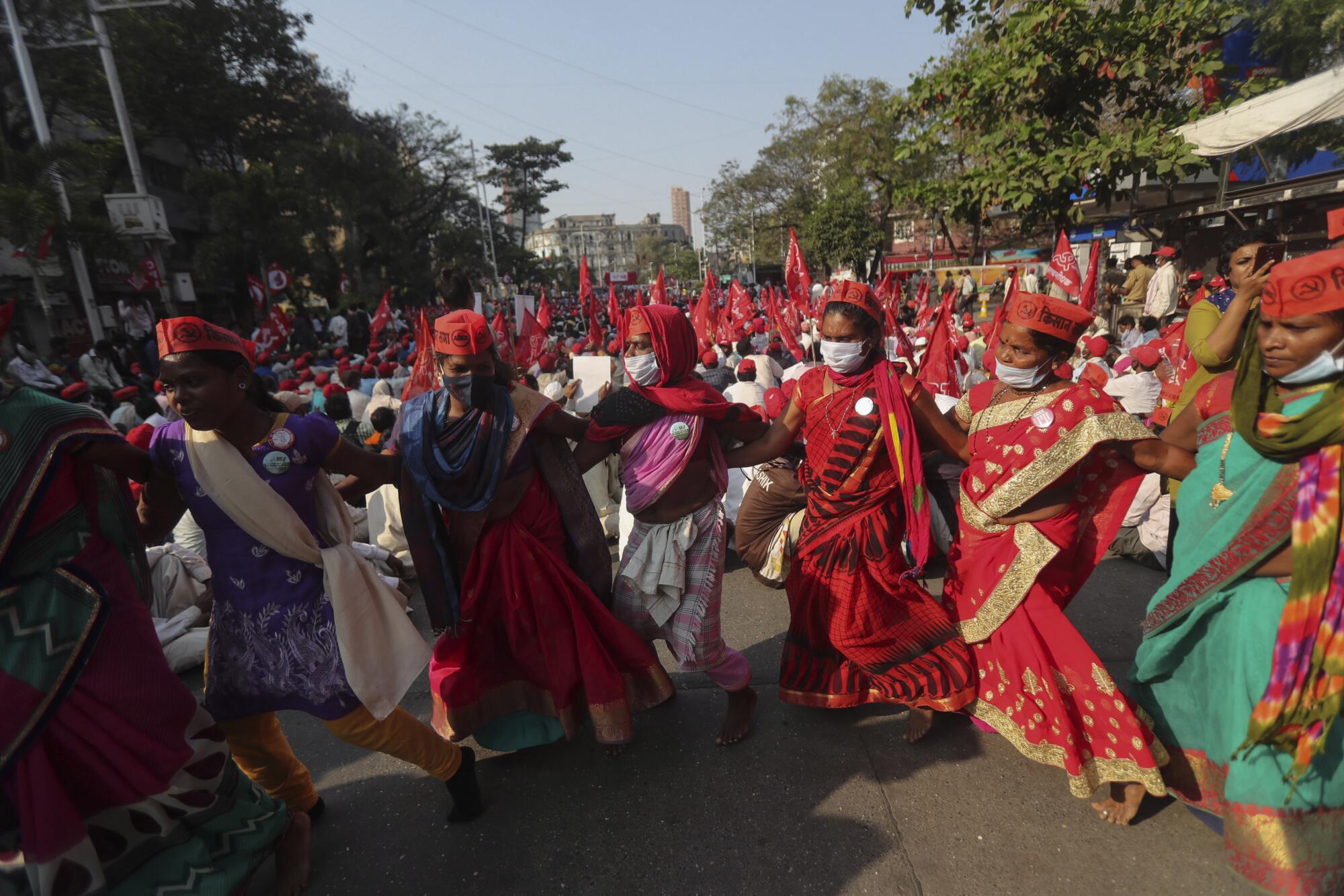 Protesting farmers dance during a rally in Mumbai, India.