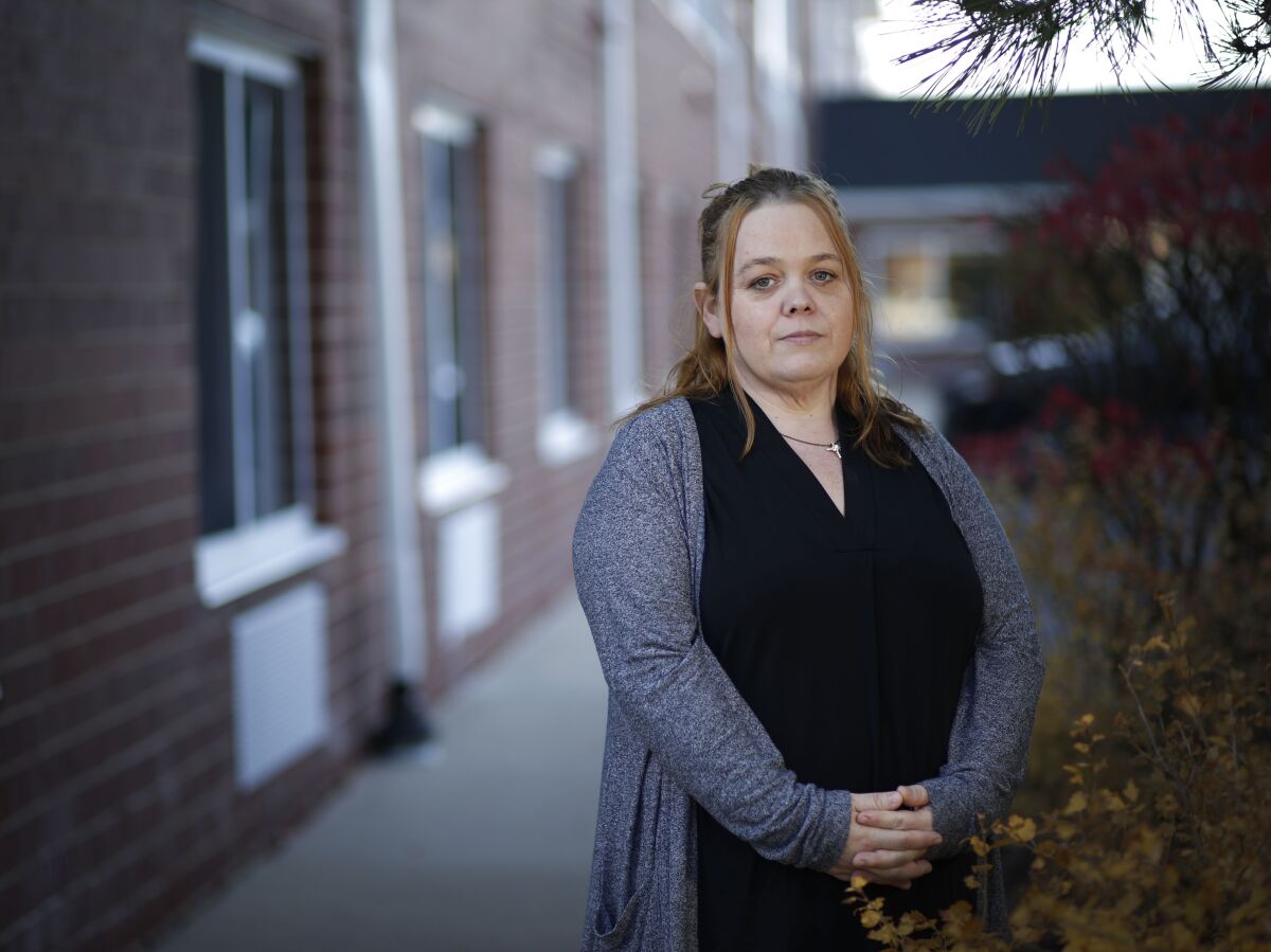 Wendy Rittenhouse poses for a portrait on Thursday, Nov. 5, 2020, in a Chicago suburb. Rittenhouse, the mother of Kyle Rittenhouse, the teen charged in the fatal shooting of two men protesting the police shooting of Jacob Blake in Kenosha, Wis., said neither her son nor the protesters should have been on the street that night and put much of the blame for what happened on police and the governor. “The police should have helped the businesses out instead of having a 17-year-old kid helping him," she said. “The police should have been involved with these people that lost their businesses. They should have stepped up." (Stacey Wescott/Chicago Tribune via AP)