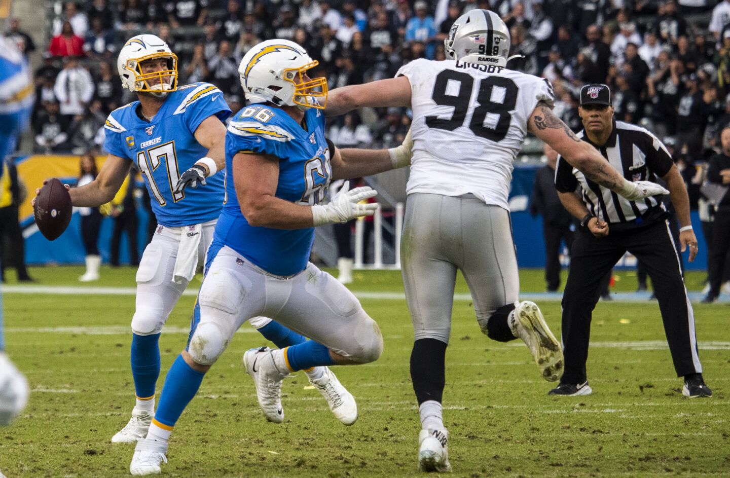 Chargers quarterback Philip Rivers looks to pass against the Oakland Raiders in the fourth quarter.