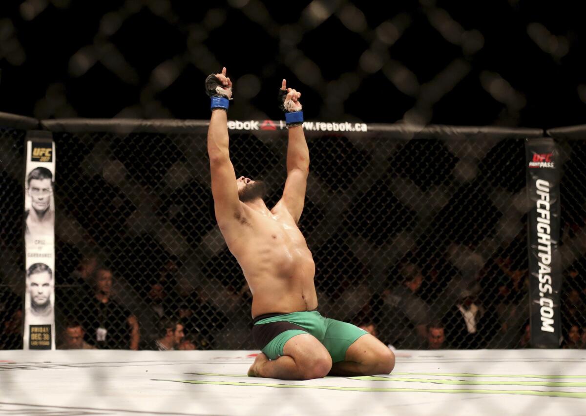Kelvin Gastelum celebrates after defeating Tim Kennedy by technical knockout in the third round of their middleweight fight at UFC 206 on Saturday in Toronto.