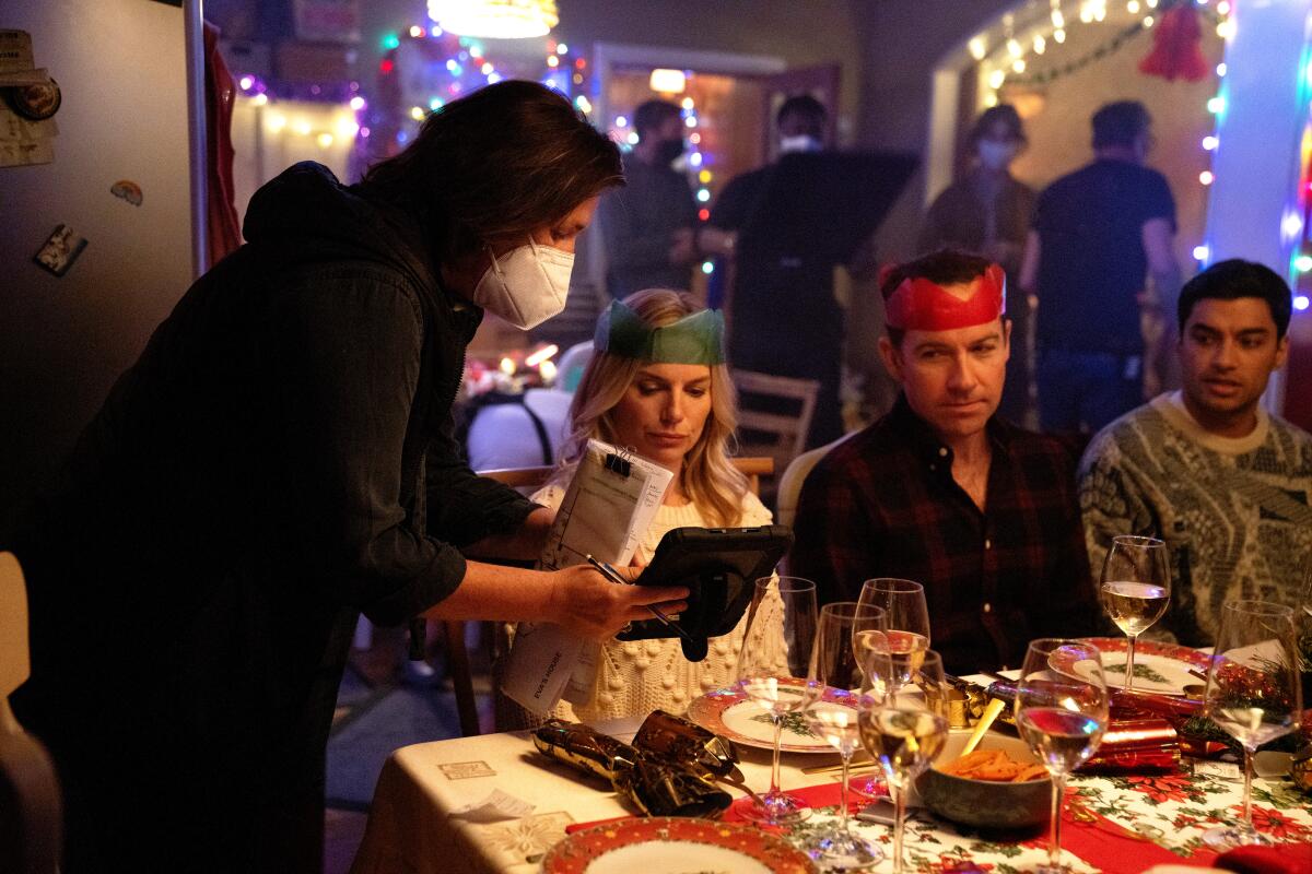 Director Dearbhla Walsh leans into a "Bad Sisters" scene set at a festive dining table to talk with the actors.