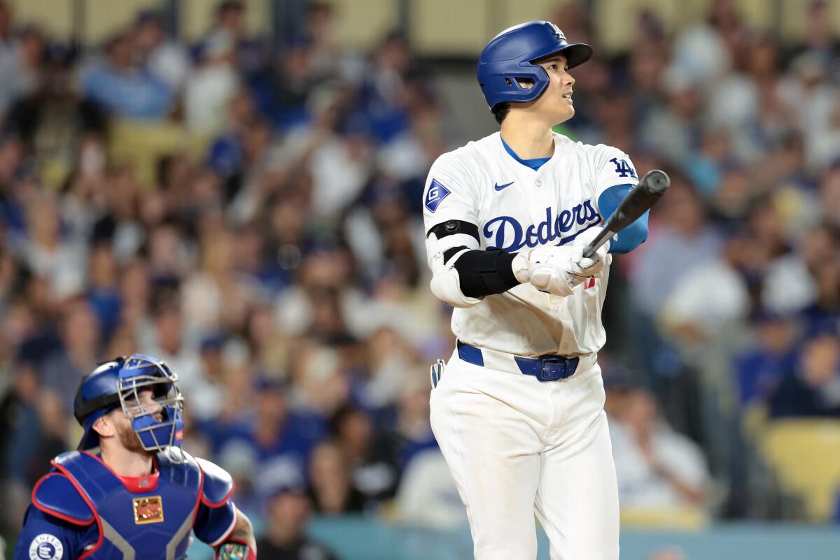 Dodgers star Shohei Ohtani hits a two-run home run against the Texas Rangers on June 11.