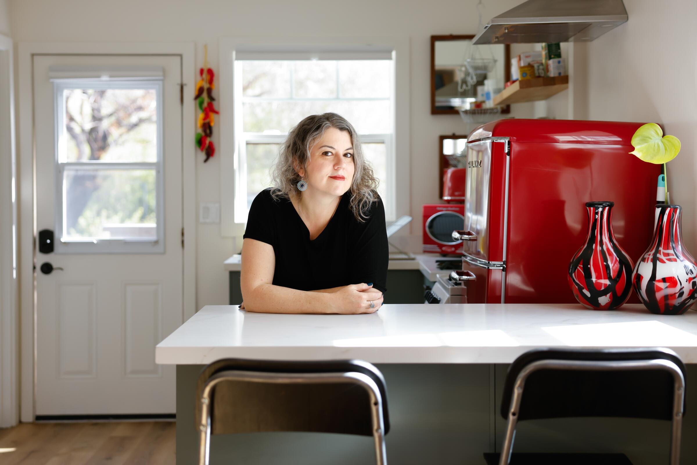 Milla Goldenberg stands in the kitchen of her garage-turned-ADU in Highland Park.