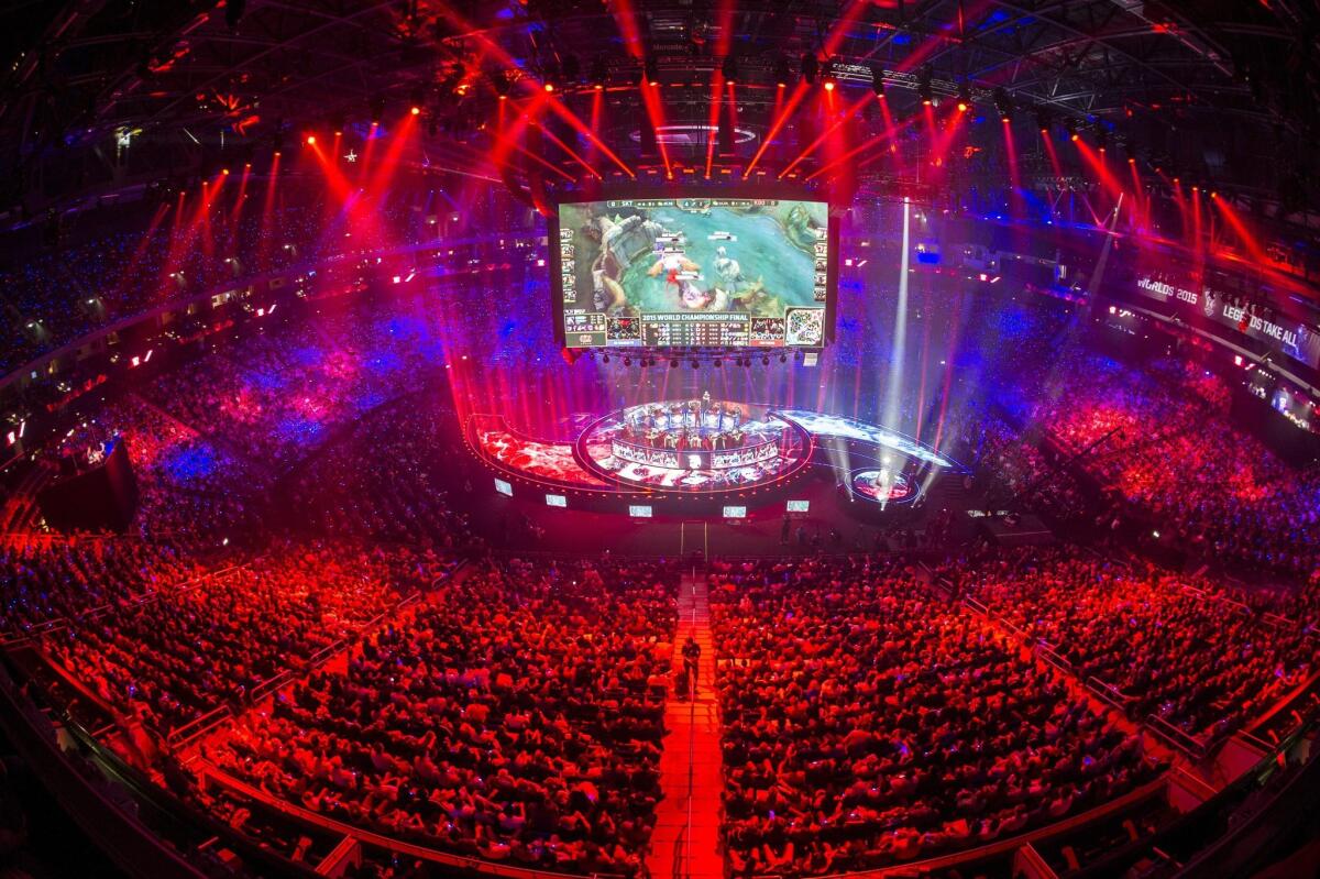 Fans watch the world championship finale of the computer game "League of Legends" in the Mercedes Benz Arena in Berlin on Oct. 31. Two teams of five seek to destroy their opponent's base on a virtual map studded with obstacles.