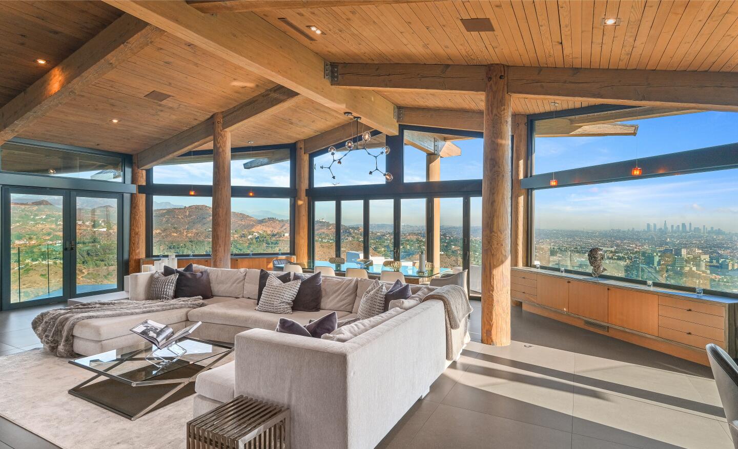 Built in the '70s but updated since, the wood-and-glass abode enjoys 300-degree views of the city below.