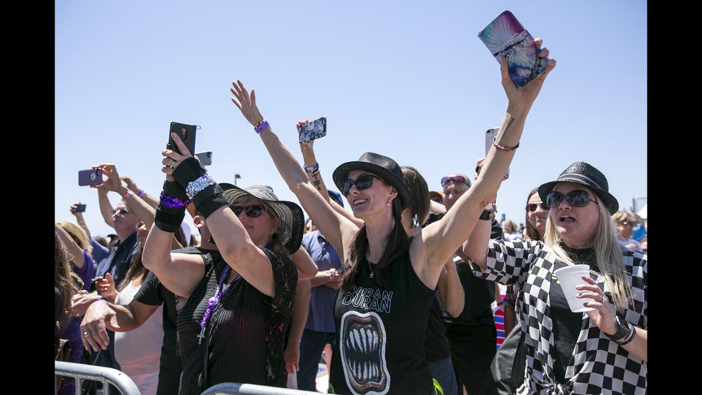 Fans dance to When In Rome UK during the Like Tottaly 80's Festival at the Huntington Beach State Park on Saturday, May 13.