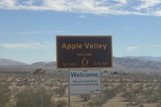 Sign welcomes you to Apple Valley, 100 miles north of Los Angeles in the high desert.