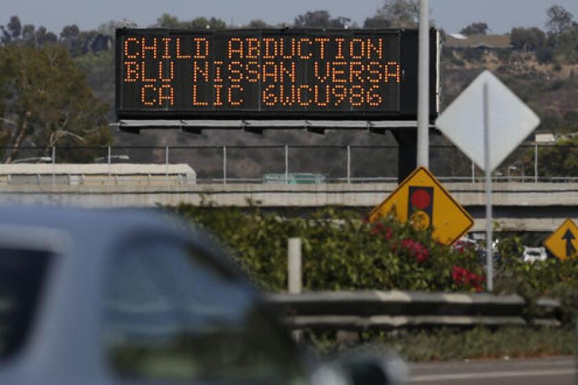 Drivers pass a display in San Diego showing an Amber Alert, asking motorists to be on the lookout for a vehicle.