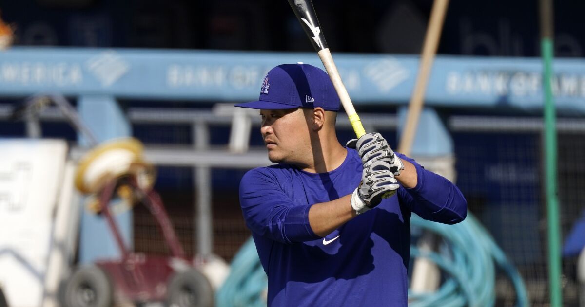 Yoshi Tsutsugo warms up before batting practice prior to Monday's game between the Dodgers and Diamondbacks.